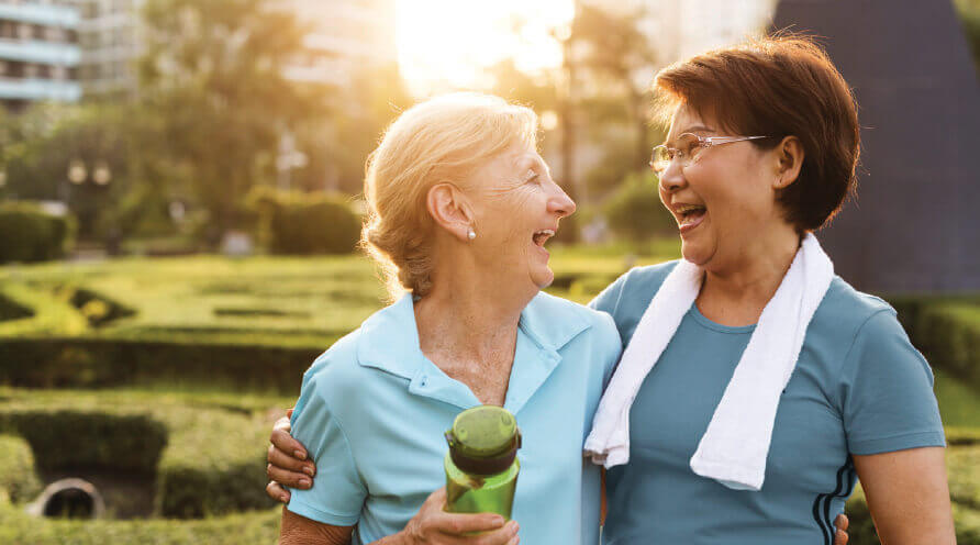 Two senior ladies smile at each other in Marysville, Washington.